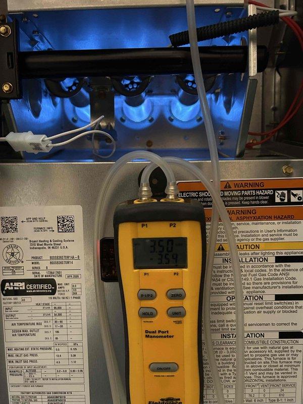 Completed full residential HVAC system installation including Bryant 70,000 BTU 80% efficiency gas furnace (Model 800SB36070M14), Bryant 2.5 ton air conditioning unit, and Bryant evaporator coil (Model CVAVA3014XMA). Removed and properly disposed of existing equipment per code requirements. Installed outdoor unit on new concrete pad with electrical whip kit, disconnect box, and insulated refrigerant lines with filter drier. Mounted evaporator coil with transition to existing ductwork and installed SS2 coil drain safety water sensor. Connected furnace to existing flue piping with flame rollout protection, installed flexible gas line connector with gas shut-off switch, and added electrical shut-off switch. Utilized existing filter return grilles and integrated new digital thermostat (Model GA5SAN53000W). Performed complete system startup, verified burner flame characteristics showing proper blue combustion, and conducted comprehensive diagnostics using calibrated instruments. Confirmed a