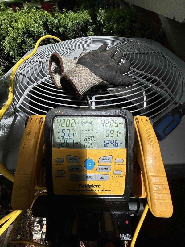 Completed full residential HVAC system installation including Bryant 70,000 BTU 80% efficiency gas furnace (Model 800SB36070M14), Bryant 2.5 ton air conditioning unit, and Bryant evaporator coil (Model CVAVA3014XMA). Removed and properly disposed of existing equipment per code requirements. Installed outdoor unit on new concrete pad with electrical whip kit, disconnect box, and insulated refrigerant lines with filter drier. Mounted evaporator coil with transition to existing ductwork and installed SS2 coil drain safety water sensor. Connected furnace to existing flue piping with flame rollout protection, installed flexible gas line connector with gas shut-off switch, and added electrical shut-off switch. Utilized existing filter return grilles and integrated new digital thermostat (Model GA5SAN53000W). Performed complete system startup, verified burner flame characteristics showing proper blue combustion, and conducted comprehensive diagnostics using calibrated instruments. Confirmed a