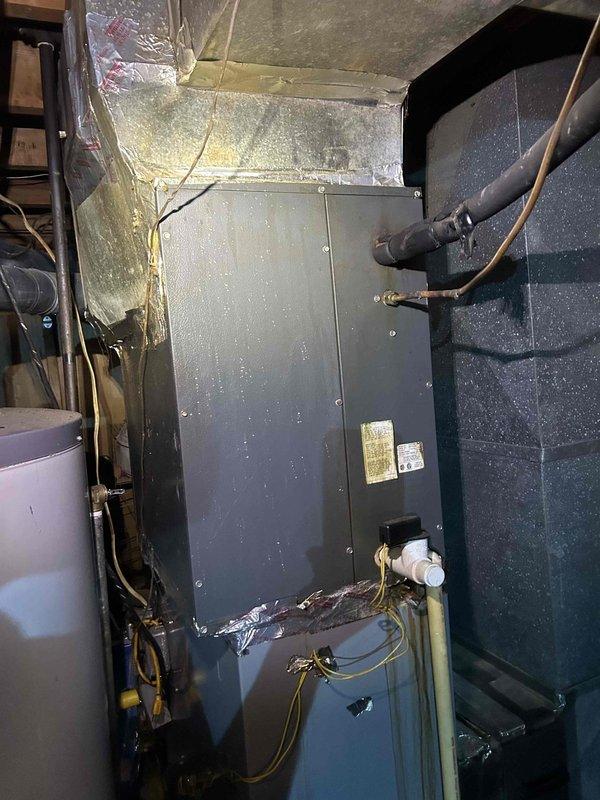 Responded to no cooling complaint with system freezing at refrigerant lines. Upon arrival, found air handler operating but producing inadequate cooling with ice formation on suction line. Inspected indoor unit and discovered heavily soiled MERV 8 filter (20x25x1) with significant dust accumulation and debris buildup restricting airflow. Restricted airflow identified as primary cause of evaporator coil freeze-up condition. Recommended immediate filter replacement and system monitoring after thaw cycle to restore proper cooling operation.