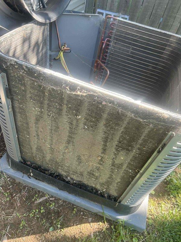 Completed routine preventative maintenance on a 3-year-old residential air conditioning system with outdoor condenser unit and attic-located air handler. Performed comprehensive AC tune-up including inspection of refrigerant lines, condensing coil, and all accessible components. Exterior of condenser unit showed significant dirt, grime, and debris accumulation requiring attention. Verified system operational status and documented equipment condition through photographic records. Customer provides their own air filters for the attic-mounted air handler and gas furnace system.
