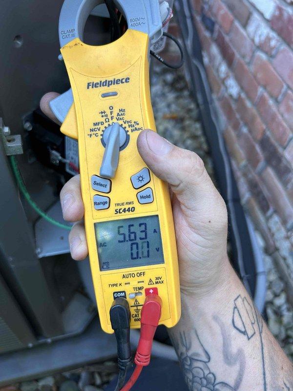 Completed Gold Level prepaid maintenance on single system with 1 heat pump and 1 air handler located in attic. Performed comprehensive system diagnostics including temperature differential measurements showing 50°F readings and electrical testing with clamp meter indicating 563 voltage at equipment. Customer supplied 20x20x1 filter for installation during service visit.