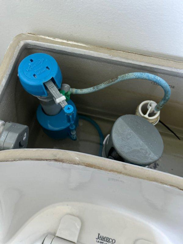 Responded to service call for gurgling freestanding sink in basement. Upon inspection, determined issue was related to plumbing venting rather than drain blockage in the sink itself. Inspected basement plumbing system and toilet fixtures to identify source of air pressure problem causing gurgling sounds. Examined toilet tank components including fill valve assembly, flapper mechanism, and flush valve system. All toilet components were functioning properly with normal water levels maintained. Verified manufacturer specifications on JAMECO 1.6 GPF toilet fixture. No immediate blockages found in visible drain lines. Advised customer that gurgling typically indicates venting issue in plumbing stack that may require further evaluation of vent pipe system to ensure proper air flow and prevent future drainage problems.