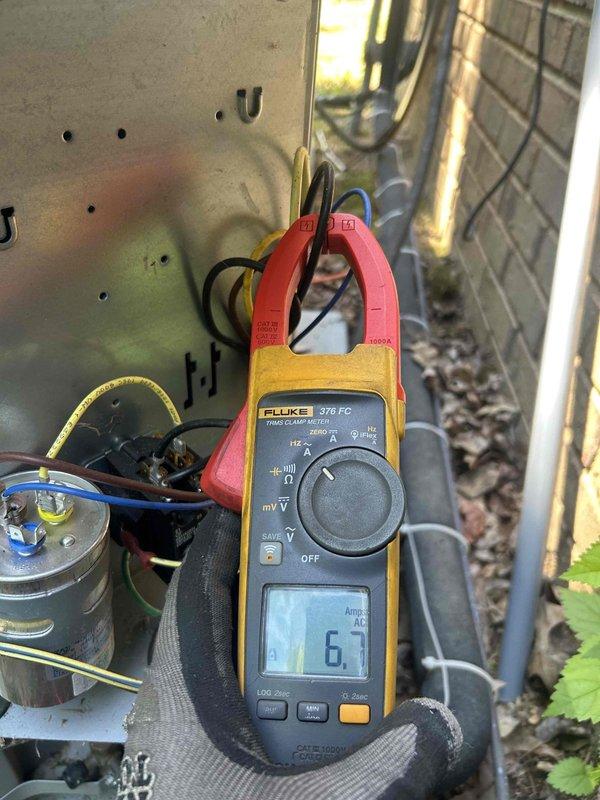 Completed Gold Level preventive maintenance on dual-system HVAC installation consisting of two gas furnaces and two air conditioning units located in attic and basement areas. Performed comprehensive system diagnostics including amperage draw measurements using clamp meter, which confirmed proper electrical operation at 6.7 amps on tested component. Inspected all major components including capacitors, wiring connections, ductwork, and PVC condensate drainage systems. Both systems operating within normal parameters with no deficiencies noted at time of service.
