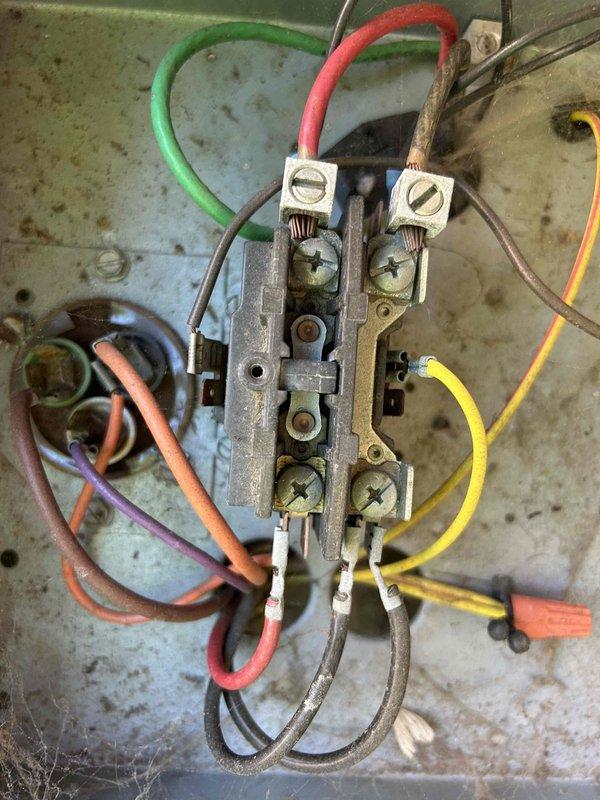 Completed annual Care Plan maintenance tune-up on gas furnace, air conditioning system, and evaporator coil located in attic space. Performed comprehensive system inspection including electrical connections at outdoor condensing unit, where terminal blocks and contactors showed age-related weathering and surface oxidation on mounting panel. Conducted electrical diagnostics using clamp meter to verify amperage draws and system performance parameters, recording readings to ensure proper operation within manufacturer specifications. Documented return filter grille sizes in ceiling for customer-supplied filter reference, as filters are maintained by homeowner per service agreement terms.