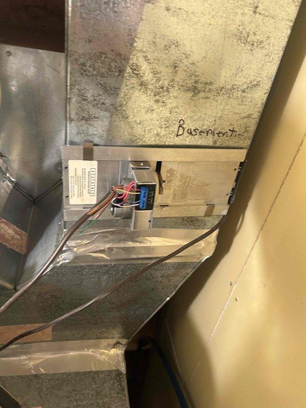 Responded to no cooling complaint on zoned HVAC system. Performed initial assessment of air handler unit installed in confined vertical chase space. Upon inspection, determined system does not require full replacement as initially suspected. Documented existing equipment condition including control board wiring, drainage lines, and installation configuration. Noted significant moisture concerns and biological growth on surrounding surfaces indicating potential condensate drainage or humidity issues affecting system performance. Recommended follow-up diagnostic service to identify specific cooling failure cause and address underlying moisture problems contributing to equipment stress and indoor air quality concerns.