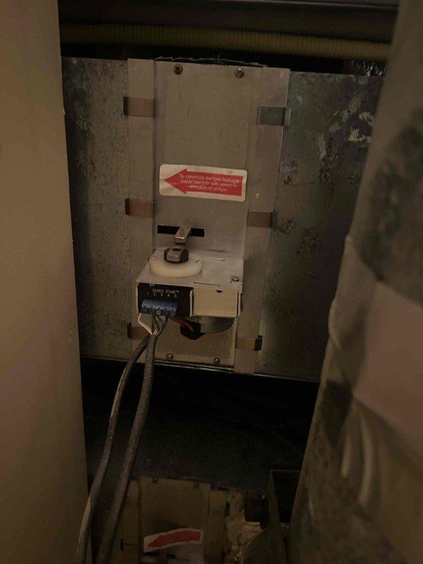 Responded to no cooling complaint on zoned HVAC system. Performed initial assessment of air handler unit installed in confined vertical chase space. Upon inspection, determined system does not require full replacement as initially suspected. Documented existing equipment condition including control board wiring, drainage lines, and installation configuration. Noted significant moisture concerns and biological growth on surrounding surfaces indicating potential condensate drainage or humidity issues affecting system performance. Recommended follow-up diagnostic service to identify specific cooling failure cause and address underlying moisture problems contributing to equipment stress and indoor air quality concerns.