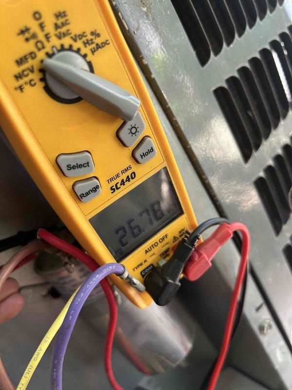 Completed Gold Level prepaid maintenance tune-up on air conditioning system with gas furnace located in crawlspace. Performed comprehensive inspection of electrical components including capacitor and contactor, verified proper connections and wire terminations. Tested capacitor using digital multimeter, recorded reading of 26.78 MFD to ensure component is functioning within specifications. Customer provided 20x25x1 air filter for installation during service visit.