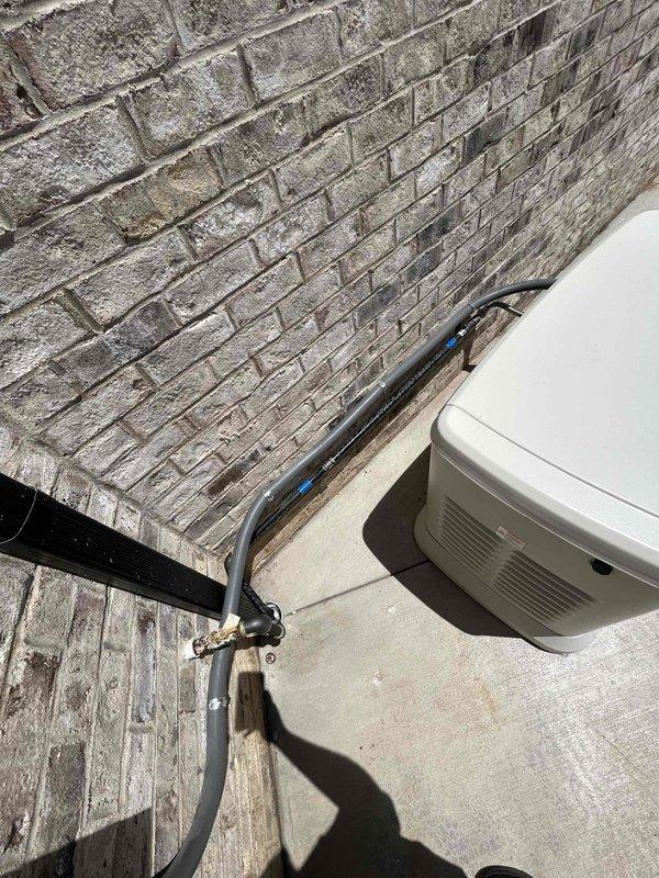 Successfully completed full electrical installation of a Generac backup generator system on rooftop concrete pad. Securely mounted generator unit to concrete surface and installed all required electrical infrastructure, including new conduit runs and generator cables from electrical panels to unit. Ran gas piping from existing shut-off valve to generator connection point. Installed battery, completed all electrical connections, and performed initial startup procedures to verify proper operation of the system.
