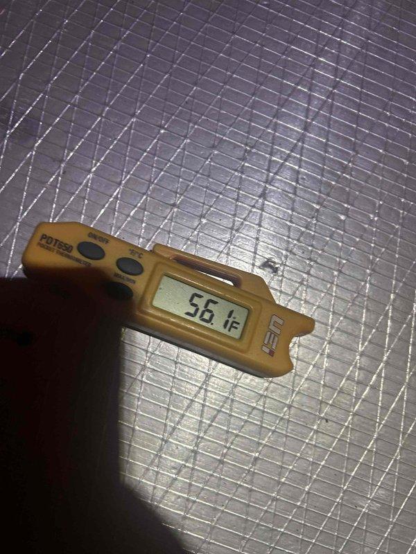 Responded to no-cooling complaint on upstairs air conditioning system. Upon arrival, found unit running continuously but failing to provide adequate cooling to conditioned space. Performed diagnostic temperature measurements at supply and return air locations. Supply air temperature measured 56°F at ductwork, while return air temperature measured 43.1°F at insulation board near air handler, indicating insufficient temperature split and compromised system performance. System exhibited short-cycling behavior with compressor turning on and off intermittently. Documented conditions with thermal readings for customer records and further evaluation of refrigerant charge, airflow restrictions, or potential compressor efficiency issues common in systems over ten years old.