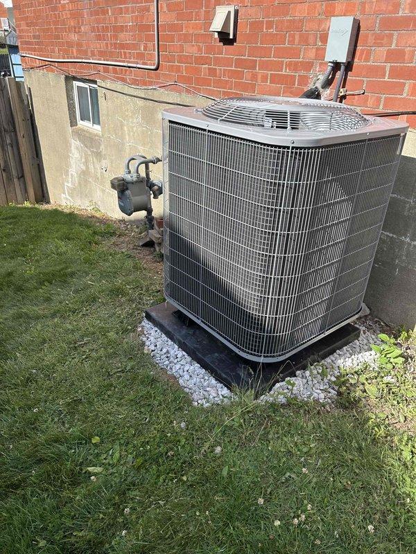 Completed full residential HVAC system replacement including installation of Bryant/Carrier GH5SAN530 2.5 ton 15.2 SEER2 single-stage heat pump and Bryant/Carrier FJ5ANXB36 multi-speed air handler with 15kW auxiliary heat kit. Installed new outdoor condenser on leveled pad with compacted gravel base, adjustable snow legs, electrical disconnect, and whip. Mounted indoor air handler with new basebox featuring built-in 1" filter rack and reconnected to existing ductwork with mastic sealant applied at all connections. Relocated thermostat to downstairs location and installed Honeywell FocusPro WiFi-enabled smart thermostat with mobile device configuration completed. Removed and hauled away all old equipment. System tested and operational with permit and inspection completed per local code requirements.
