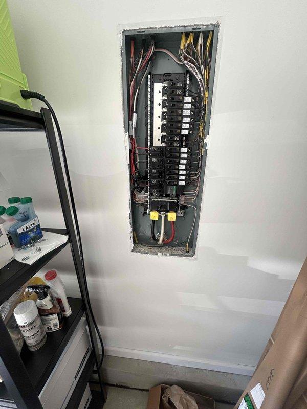 Conducted comprehensive electrical assessment for electric vehicle charging station installation in garage. Evaluated existing electrical panel capacity, available breaker spaces, and wire routing requirements from main panel to proposed charger location. Documented current panel configuration showing adequate 200-amp service with available spaces for dedicated EV circuit installation. Assessed wire run distance and determined optimal conduit pathway for Level 2 charging station installation. Provided detailed estimate for complete installation including 240-volt dedicated circuit, appropriate gauge wiring, conduit installation, and mounting of EV charging unit.