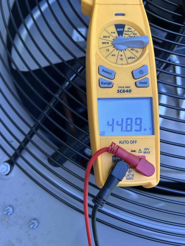 Completed preventive maintenance tune-up on heat pump and air handler system located in basement as part of care plan service. Inspected evaporator coil with vertical aluminum fins, verified proper operation of blower assembly, tested system performance with digital multimeter recording 44.89 reading, and documented equipment condition in insulated mechanical space. All components found operating within normal parameters with no immediate service needs identified.