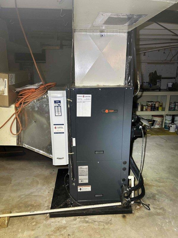 Completed comprehensive Care Plan maintenance on Trane geothermal air handler unit. Performed system diagnostics and measurements, recording operating temperature of 59.5°F, inspected refrigerant lines and insulation for proper condition, verified electrical connections and conduit integrity, and documented equipment condition through detailed photography. All components found operating within normal parameters with no immediate service needs identified.