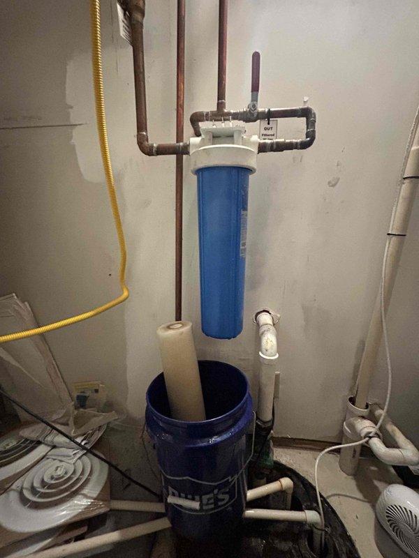 Performed annual maintenance service on three tankless water heaters including complete system flush to remove mineral buildup and ensure optimal performance. Replaced water filter cartridges using customer-supplied units, documented filter specifications (blue cylindrical whole-house filter housing with white end caps) for future service reference, and verified all plumbing connections and valves for proper operation throughout the system.