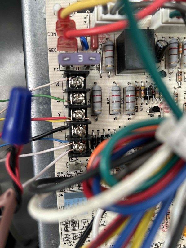 Completed annual care plan maintenance tune-up on HVAC system as part of complimentary first-year service included with equipment installation. Performed comprehensive system inspection including examination of control board components, verified all wire connections at terminal blocks, and tested electrical parameters using clamp meter which confirmed proper amperage draw of 5.98A. All electronic components, resistors, capacitors, and low-voltage thermostat wiring connections found to be in good working condition with no issues identified.