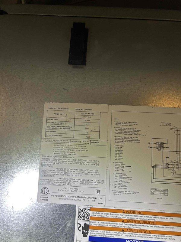 Responded to no cooling complaint on 2-year-old electric HVAC system that had been inoperative for several weeks. Performed diagnostic evaluation of indoor unit located in front door closet. Inspected thermostat operation showing 67°F display reading with system set to cooling mode, verified thermostat programming and control settings, and examined equipment nameplate specifications and safety labels on indoor unit.
