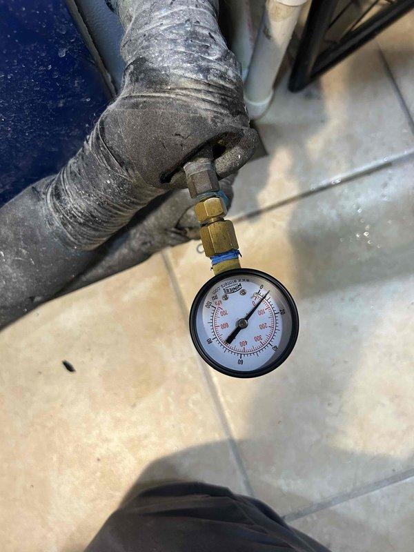 Completed comprehensive Care Plan tune-up on basement HVAC unit with washable filter. Performed system diagnostics including pressure testing and temperature verification, recording 33°F at evaporator coil which indicates proper cooling operation. Inspected air handler components, ductwork insulation, and verified all mechanical connections for optimal system performance.