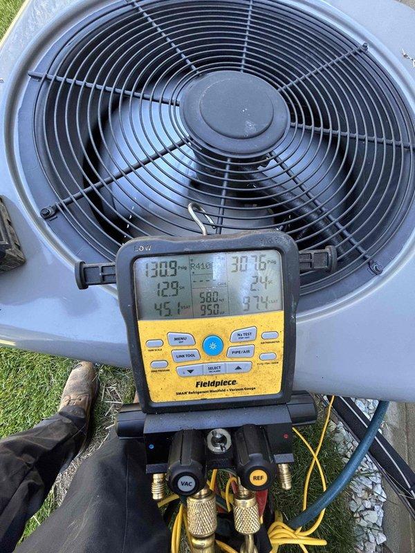 Completed routine HVAC maintenance on heat pump system with air handler located in attic. Verified thermostat operation showing proper temperature reading of 73 degrees with system responding appropriately to programmed settings. Performed diagnostic testing on outdoor condensing unit using calibrated manifold gauges to measure system pressures and temperatures, confirming refrigerant charge and overall system performance within manufacturer specifications. Customer provides their own air filtration for the attic-mounted air handler unit.