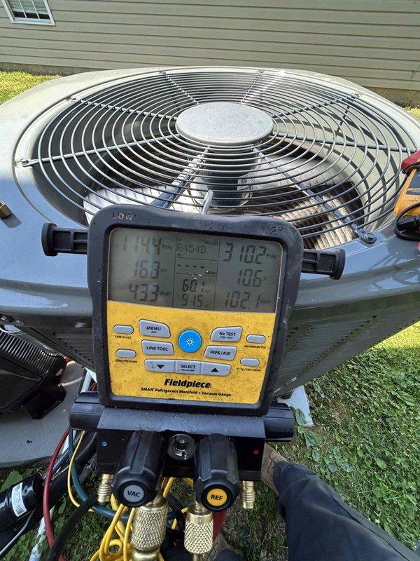 Performed comprehensive Care Plan tune-up on two newly installed heat pump systems with air handlers located in basement and attic. Completed full system diagnostics on both outdoor units using digital manifold gauges, recording refrigerant pressures, temperatures, superheat, and subcool readings to verify proper system operation and charge levels. All measurements confirmed systems operating within manufacturer specifications with appropriate refrigerant charge and airflow.