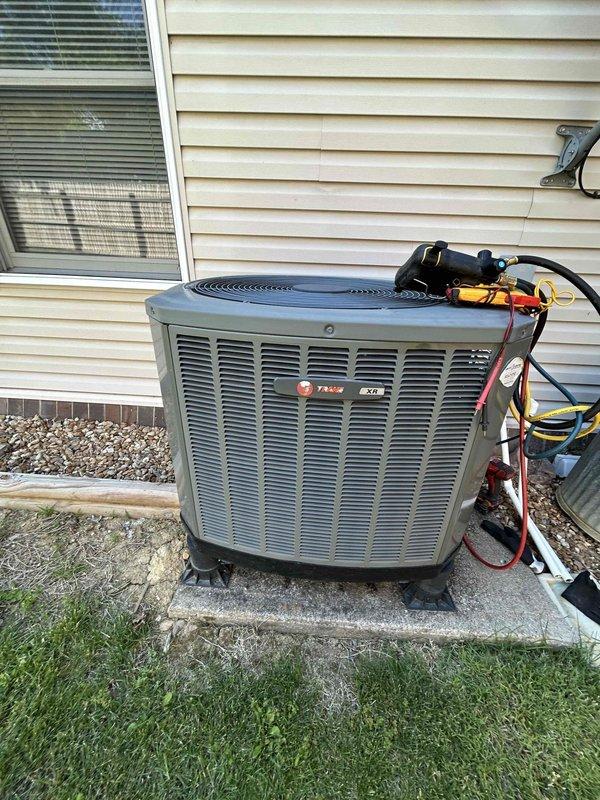 Completed scheduled maintenance tune-up on Trane heat pump system with air handler located in attic per care plan agreement. Performed comprehensive inspection of outdoor condenser unit including refrigerant line connections, electrical components, and system diagnostics, along with interior air handler assessment using diagnostic instruments to measure airflow and system performance at supply registers. All components found operating within normal parameters with no deficiencies noted during inspection.