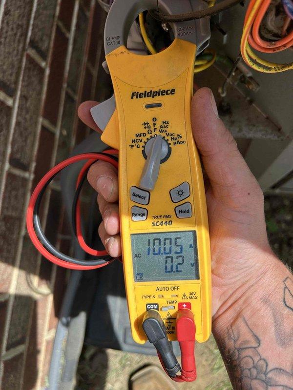 Responded to no cooling call on 9-year-old AC system. Found outdoor unit not running while indoor blower operated normally. Performed system reset by cycling breaker and thermostat, which temporarily restored outdoor unit operation before it shut down again. Diagnosed failed contactor preventing consistent compressor operation. Measured supply air temperature at 50°F from register and verified electrical readings at outdoor unit using clamp meter. Replaced defective contactor, restored full system operation, and confirmed proper cooling cycle.