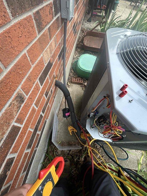 Completed annual Care Plan tune-up on heat pump system with air handler and electronic air cleaner located in closet. Performed comprehensive maintenance inspection of outdoor condenser unit, verified electrical connections and amperage readings using clamp meter, checked refrigerant line connections, and confirmed thermostat operation displaying 69°F setpoint with system maintaining proper temperature control. Customer provides their own filter for the system.