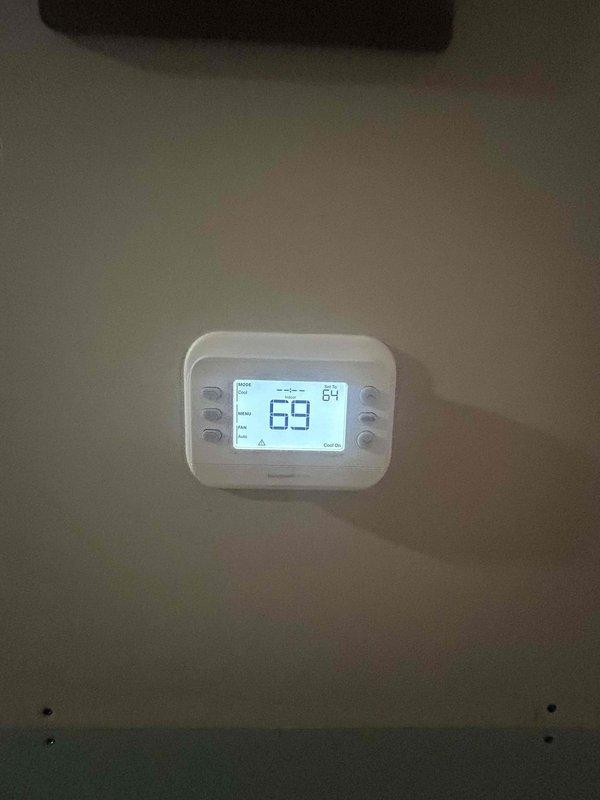 Completed annual Care Plan tune-up on heat pump system with air handler and electronic air cleaner located in closet. Performed comprehensive maintenance inspection of outdoor condenser unit, verified electrical connections and amperage readings using clamp meter, checked refrigerant line connections, and confirmed thermostat operation displaying 69°F setpoint with system maintaining proper temperature control. Customer provides their own filter for the system.