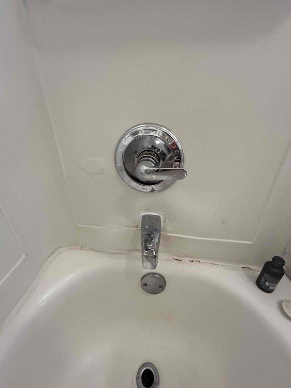 Responded to service call for low water pressure issue affecting bathtub fixture. Upon arrival, accessed property via disabled ramp side entrance and inspected bathroom plumbing system. Evaluated bathtub and shower combination unit with chrome fixtures, including single-lever shower control valve and tub spout. Tested water flow at bathtub spout and showerhead to diagnose pressure deficiency. Determined cause of reduced water pressure and performed necessary corrective measures to restore proper flow rate to bathtub fixture. Verified adequate water pressure restoration throughout bathtub and shower system upon completion.
