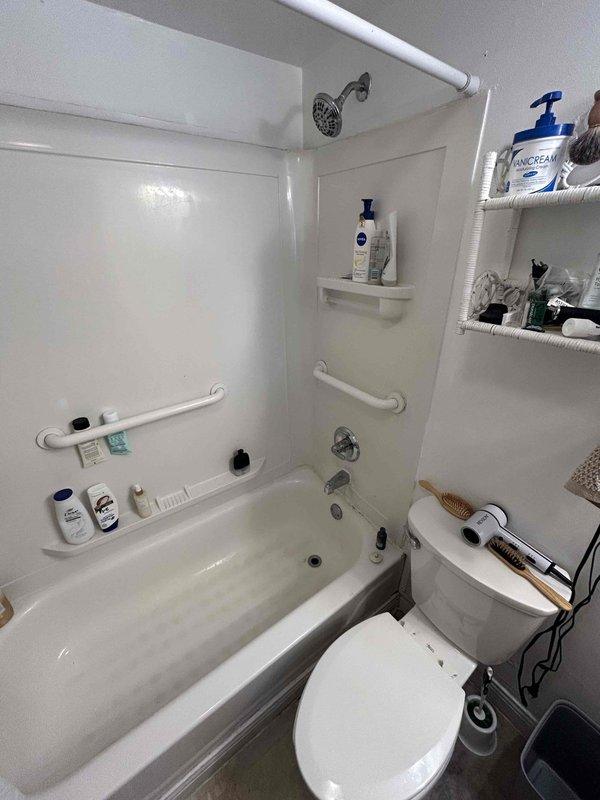Responded to service call for low water pressure issue affecting bathtub fixture. Upon arrival, accessed property via disabled ramp side entrance and inspected bathroom plumbing system. Evaluated bathtub and shower combination unit with chrome fixtures, including single-lever shower control valve and tub spout. Tested water flow at bathtub spout and showerhead to diagnose pressure deficiency. Determined cause of reduced water pressure and performed necessary corrective measures to restore proper flow rate to bathtub fixture. Verified adequate water pressure restoration throughout bathtub and shower system upon completion.