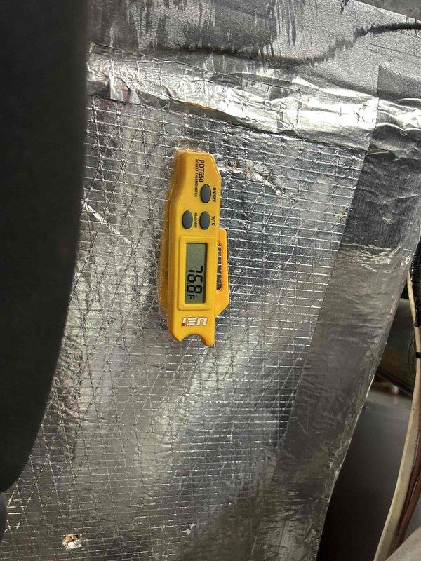 Responded to no cooling complaint on 4-year-old Bryant AC system blowing warm air with indoor temperature reading 75°F against 69°F setpoint. Performed diagnostic evaluation of outdoor condensing unit and indoor air handler located in basement. Measured supply air temperatures at ductwork using digital thermometer to verify cooling performance. Inspected refrigerant lines, electrical connections, and overall system operation to identify cause of warm air discharge that began previous evening.