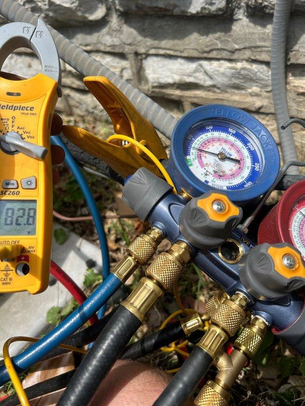 Responded to no cooling complaint on 17-year-old upstairs heat pump system with indoor unit located in attic. Performed diagnostic testing using manifold gauges and clamp meter to measure refrigerant pressures and electrical current at outdoor unit. Testing revealed system operating parameters were outside normal range, indicating potential refrigerant charge issue or compressor performance problem requiring further evaluation and repair.