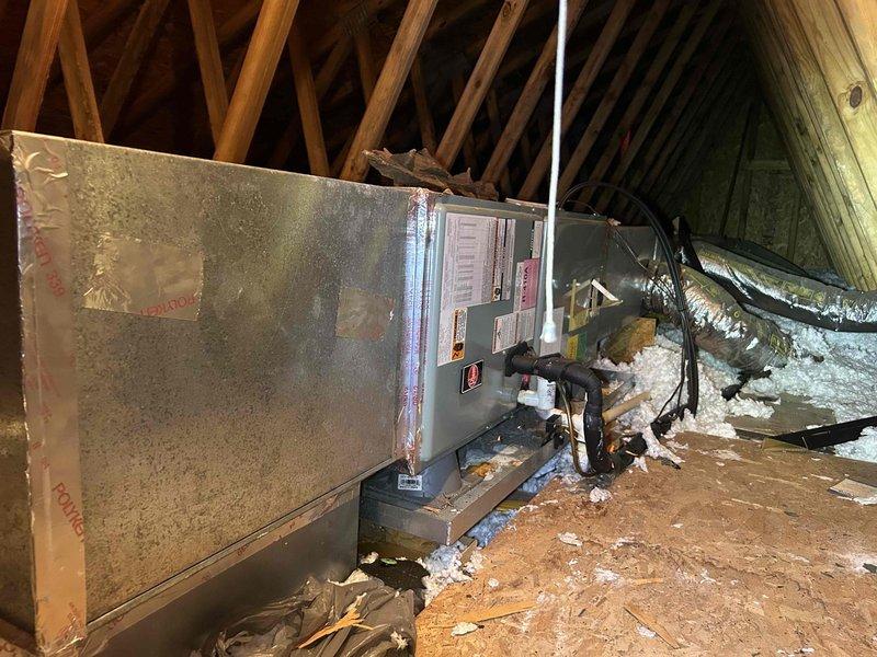Responded to no cooling complaint on 12-year-old electric HVAC system where outdoor unit was humming but condenser fan would not engage. Upon inspection, diagnosed failed run capacitor on outdoor condensing unit. Capacitor exhibited significant age-related deterioration including corrosion, discoloration, and loss of capacitance. Replaced defective run capacitor with new component matching manufacturer specifications. Verified proper fan motor operation, checked amperage draws on compressor and fan motor, and confirmed system returned to normal cooling operation. Also inspected attic-mounted air handler unit and noted frost accumulation on exterior surfaces indicating possible airflow restriction or refrigerant issue that may require future attention if cooling performance does not normalize after capacitor replacement.