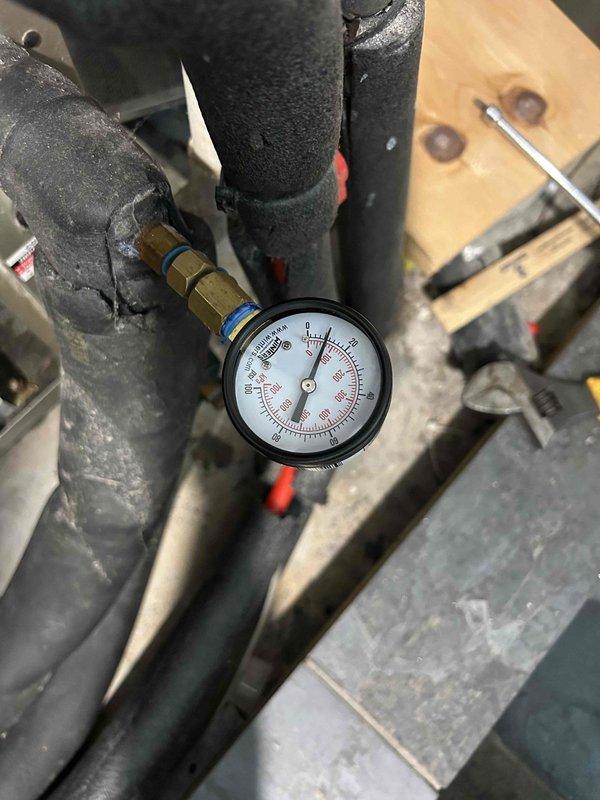 Responded to no cooling complaint on 6-year-old gas furnace system with indoor unit located in basement. Upon arrival, performed diagnostic evaluation of the air conditioning system including refrigerant pressure testing and temperature measurements. Pressure gauge readings were taken at the refrigerant lines, and supply air temperature was measured at 78.2°F at the ductwork, confirming inadequate cooling performance. Identified system deficiency through systematic troubleshooting of refrigeration cycle components and airflow characteristics.