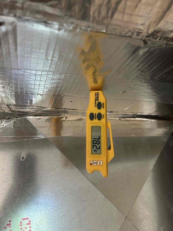 Responded to no cooling complaint on 6-year-old gas furnace system with indoor unit located in basement. Upon arrival, performed diagnostic evaluation of the air conditioning system including refrigerant pressure testing and temperature measurements. Pressure gauge readings were taken at the refrigerant lines, and supply air temperature was measured at 78.2°F at the ductwork, confirming inadequate cooling performance. Identified system deficiency through systematic troubleshooting of refrigeration cycle components and airflow characteristics.