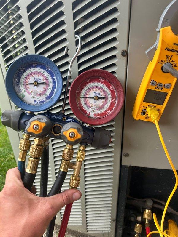 Responded to no cooling complaint on 15-year-old heat pump system unable to maintain setpoint of 69°F, running at 73°F. Performed diagnostic evaluation of outdoor unit using manifold gauges to measure refrigerant pressures and digital multimeter to test electrical components. System assessment revealed age-related performance degradation affecting cooling capacity and efficiency.