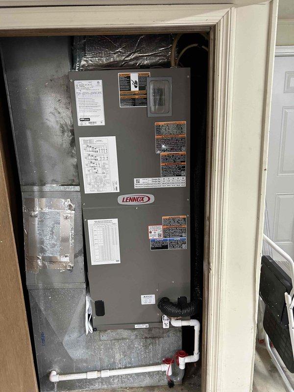 Completed full residential HVAC system replacement installing Lennox ML14KP1-042-230 heat pump outdoor unit and CBK45UHET-042-230-71 air handler with complete removal and disposal of existing equipment. Installed new refrigerant lineset with insulation, new thermostat wiring, outdoor unit pad with snow legs, electrical disconnect box with whip kit, and refrigerant line filter. Air handler installation included drain trap, SS2 coil drain safety water sensor, ceiling saver overflow drain pan with water sensor, transition to existing ductwork, and standard air filter rack, all mounted in interior utility closet with proper PVC condensate drainage system and red-handled shutoff valves. Outdoor condenser positioned on concrete pad against exterior brick wall with proper clearances for service access and airflow. All electrical connections completed to code with conduit run from disconnect box to unit, system charged and tested for proper operation, and all applicable permits obtained for in