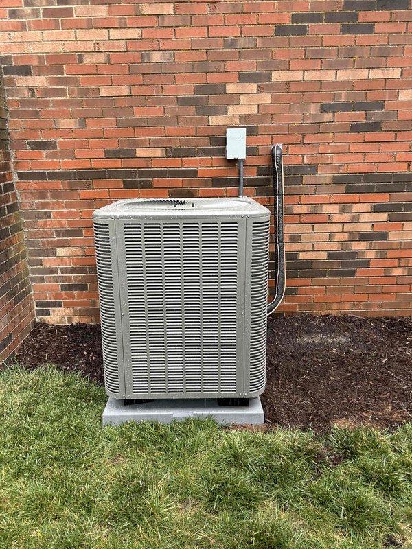Completed full residential HVAC system replacement installing Lennox ML14KP1-042-230 heat pump outdoor unit and CBK45UHET-042-230-71 air handler with complete removal and disposal of existing equipment. Installed new refrigerant lineset with insulation, new thermostat wiring, outdoor unit pad with snow legs, electrical disconnect box with whip kit, and refrigerant line filter. Air handler installation included drain trap, SS2 coil drain safety water sensor, ceiling saver overflow drain pan with water sensor, transition to existing ductwork, and standard air filter rack, all mounted in interior utility closet with proper PVC condensate drainage system and red-handled shutoff valves. Outdoor condenser positioned on concrete pad against exterior brick wall with proper clearances for service access and airflow. All electrical connections completed to code with conduit run from disconnect box to unit, system charged and tested for proper operation, and all applicable permits obtained for in