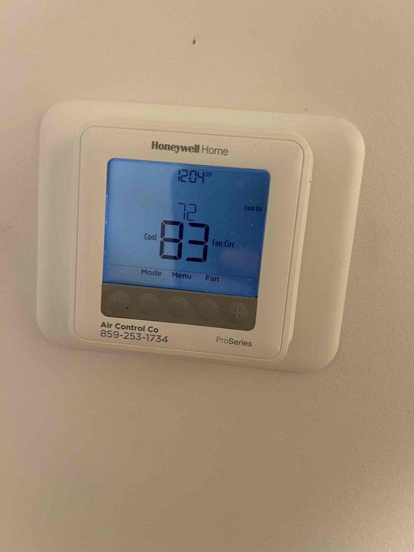 Responded to no cooling complaint on 5-year-old electric air conditioning system. Upon arrival, thermostat displayed 83°F actual temperature while set to 72°F in cooling mode with fan circulating. Performed diagnostic evaluation of indoor air handler and outdoor condensing unit located in multi-unit installation. Identified system malfunction, completed necessary repairs to restore proper cooling operation, and verified system functionality before departure.