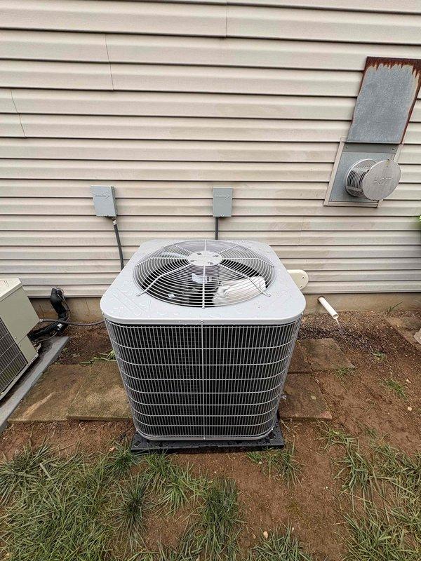 Completed full residential HVAC system installation including Bryant 60K BTU 96% efficiency gas furnace (model 916SA36060M14), Bryant 2-ton 16 SEER2 air conditioning condenser unit (model GA5SAN52400W), and Bryant 2-ton evaporator coil (model CVAVA2414XMA). Installed digital thermostat, condensate pump, and REME Halo UV air purification system for enhanced indoor air quality. Applied new ArmaFlex insulation to outdoor suction lines, drilled and installed 2" PVC concentric vent kit through exterior wall for furnace exhaust and intake, and positioned condenser unit on concrete pad with proper electrical connections and refrigerant line routing. Removed and disposed of existing equipment, pulled necessary permits, and tested all system components for proper operation and code compliance.