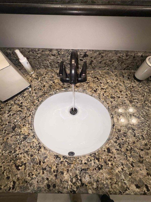 Completed routine plumbing inspection of bathroom fixtures as part of preventative service agreement. Performed operational testing of faucet, verified proper water flow and drainage at vanity sink, and inspected shut-off valves beneath the fixture to ensure proper function and absence of leaks.
