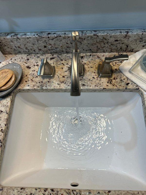 Completed routine plumbing inspection as part of preventative service agreement. Verified proper water flow and drainage at bathroom sink fixture, tested faucet operation and water supply controls, and inspected accessible plumbing infrastructure in attic space for any visible leaks, proper insulation clearances, or maintenance concerns. All plumbing systems found operating within normal parameters with no immediate issues identified.