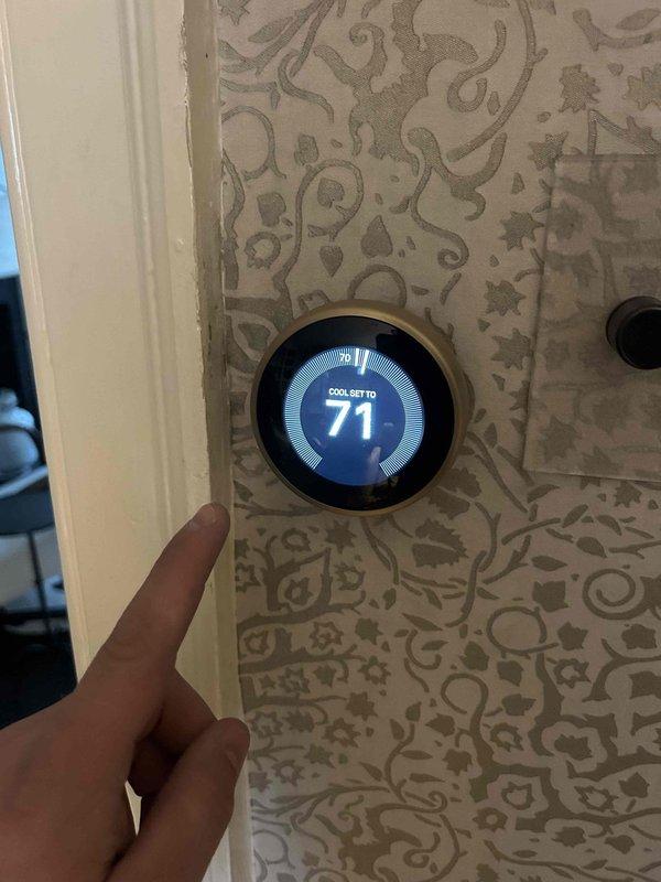 Responded to service call for air conditioning system not adequately cooling unoccupied residence. Upon arrival, verified thermostat set to 71°F in cooling mode and inspected HVAC equipment. Examined air handler unit and confirmed GeneralAire 16x25x5 MERV-rated filter was installed in system. System evaluated for cooling performance concerns reported by property caretaker.