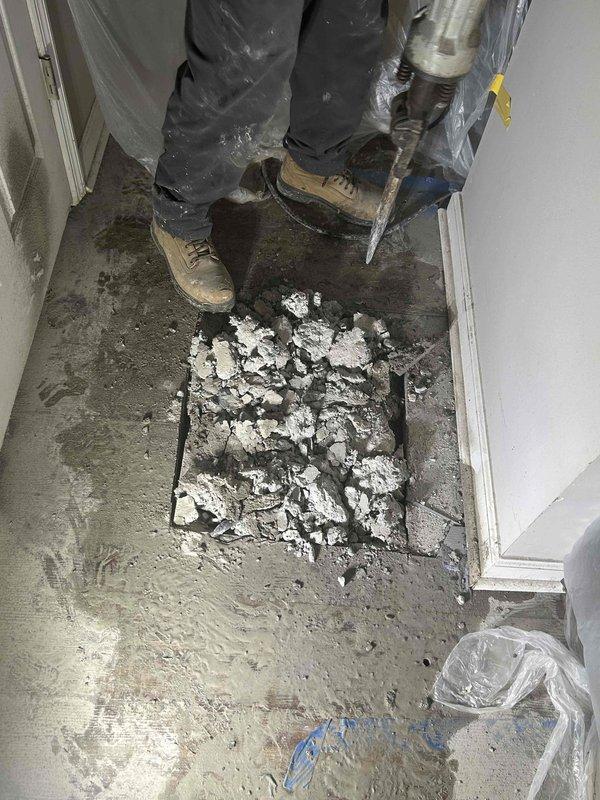 Responded to a slab leak in copper water line previously identified by leak detection services. Cut and removed interior flooring at marked location and used concrete saw and jackhammer to access the affected plumbing line beneath the slab. Located the leaking copper pipe, performed necessary repairs to restore water line integrity, and wrapped the repaired section for protection. Poured concrete to restore the slab foundation and verified proper system function with no additional leaks detected before completing the work.