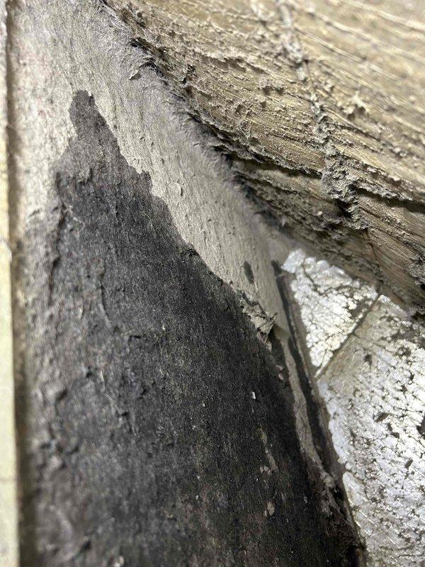 Responded to no-cooling complaint on 17-year-old Carrier electric HVAC system located in utility room. Upon arrival, unit was off due to evaporator coil freeze-up occurring over previous several days. Performed diagnostic evaluation and confirmed suspected refrigerant leak. Documented system condition including deteriorated wooden structural support elements near installation area showing significant moisture damage and wood rot. Recommended system replacement due to age, refrigerant leak, and compromised installation integrity.