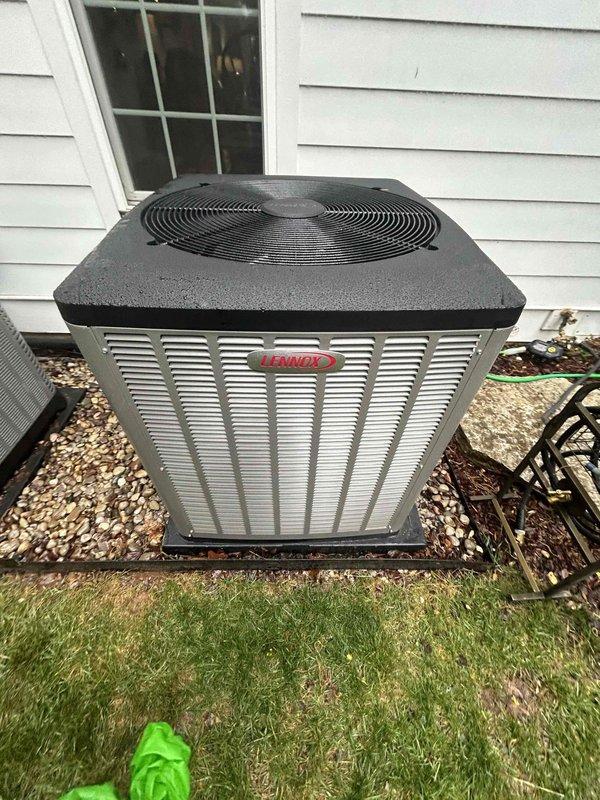 Replaced outdoor condensing unit under manufacturer's 1-year warranty with new Lennox equipment. Installed surge protector for electrical protection and documented new unit's nameplate information with photographs for warranty claim processing.