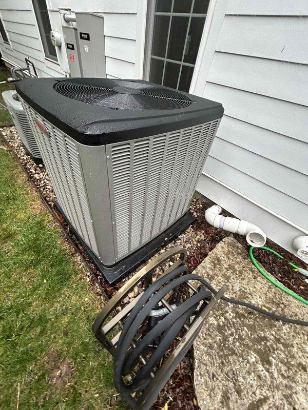Replaced outdoor condensing unit under manufacturer's 1-year warranty with new Lennox equipment. Installed surge protector for electrical protection and documented new unit's nameplate information with photographs for warranty claim processing.