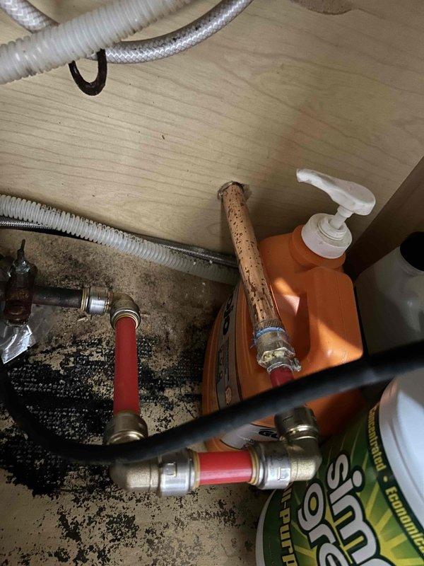 Responded to reported water leak at 30-year-old residential property involving burst pipe connected to exterior hose bib. Upon inspection, identified failed compression fitting and damaged supply line running from outdoor spigot to interior plumbing system. Accessed under-sink cabinet area to assess extent of water damage and trace leak source to compromised pipe connection. Replaced faulty brass compression fittings, installed new flexible supply line, and secured all connections with appropriate fasteners. Verified outdoor hose bib mounting integrity and tested system for proper water flow and pressure. Confirmed no active leaks present after repairs and ensured all plumbing components functioning correctly.