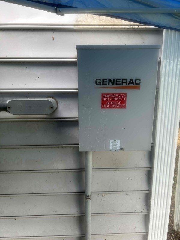 Removed existing 16KW standby generator and 100 AMP transfer switch from beneath deck structure. Installed new 18KW Generac air-cooled standby generator on prepared gravel pad with proper clearances for ventilation and service access. Mounted new 100 AMP non-service rated automatic transfer switch on exterior wall with appropriate conduit runs and emergency disconnect box. Verified all electrical connections, tested system operation through multiple transfer cycles, and confirmed proper generator startup and load transfer functionality.