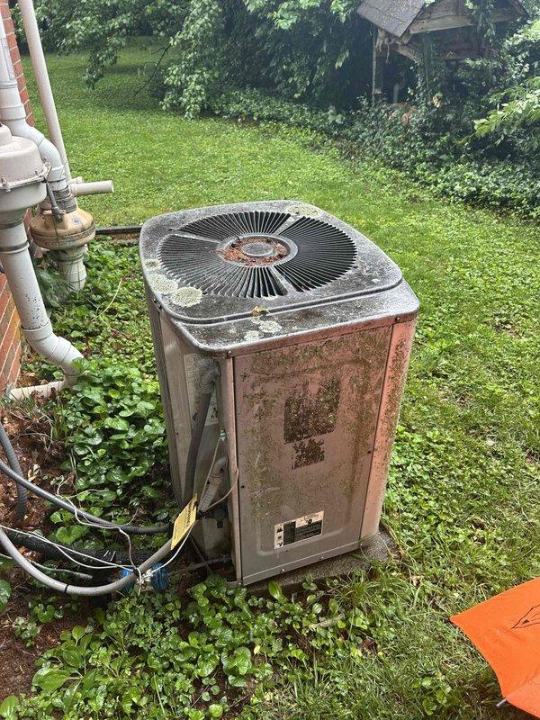 Responded to no cooling call on 15-year-old residential air conditioning system. Upon arrival, confirmed indoor blower motor operational but outdoor condenser unit fan not running. Performed diagnostic testing on outdoor unit using clamp meter, measuring electrical parameters at the condenser. Found outdoor fan motor failed with no amperage draw detected. Unit exhibited significant weathering, corrosion, and rust deterioration consistent with age and extended outdoor exposure. Due to the system's age exceeding typical equipment lifespan and the extent of deterioration observed, recommended full system replacement rather than repair. Discussed options with customer regarding continued operation and replacement considerations for aging equipment.