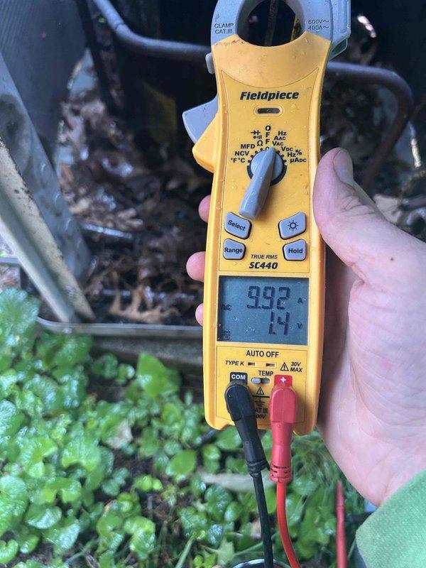 Responded to no cooling call on 15-year-old residential air conditioning system. Upon arrival, confirmed indoor blower motor operational but outdoor condenser unit fan not running. Performed diagnostic testing on outdoor unit using clamp meter, measuring electrical parameters at the condenser. Found outdoor fan motor failed with no amperage draw detected. Unit exhibited significant weathering, corrosion, and rust deterioration consistent with age and extended outdoor exposure. Due to the system's age exceeding typical equipment lifespan and the extent of deterioration observed, recommended full system replacement rather than repair. Discussed options with customer regarding continued operation and replacement considerations for aging equipment.